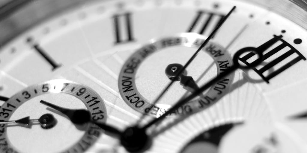 A close-up shot of a vintage calendar, specifically focusing on a single date circled in red ink. The calendar should be slightly worn, with yellowed pages and perhaps a few dog-eared corners. The lighting should be soft and warm, creating a nostalgic feel. The date itself should be clearly visible and the main focal point. The background should be blurred to emphasize the date.