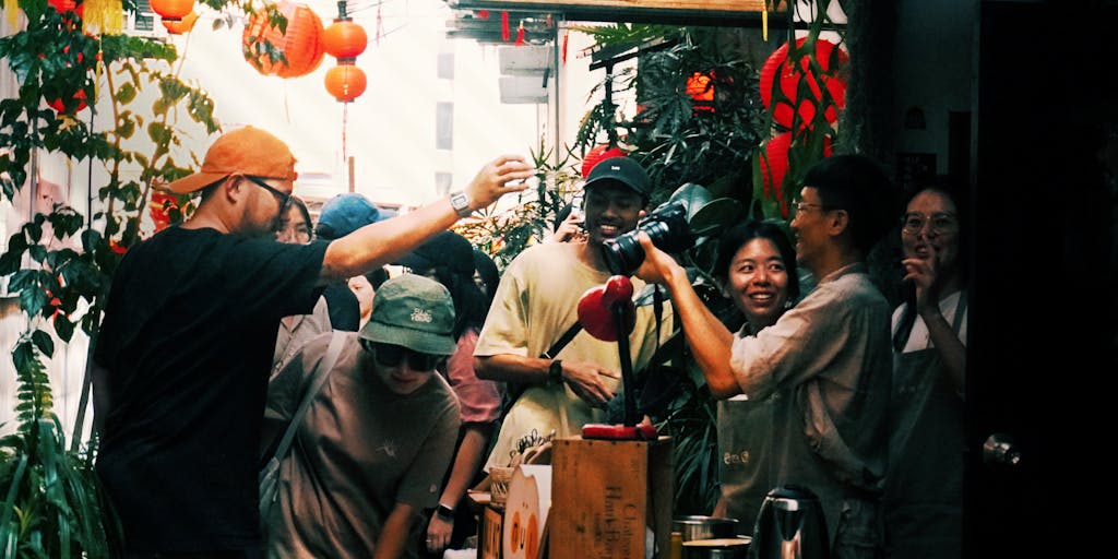 A dynamic photo of a group of friends laughing and celebrating at a party, with one person holding a sign that says 'Periodt!' in a fun, playful font. The scene is filled with balloons and confetti, capturing the joy and camaraderie that the term represents.