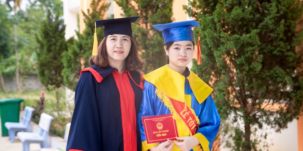 A heartwarming scene of a parent and their college-aged child sharing a moment in a cozy living room, with the parent handing over a check or financial aid letter. The background features graduation photos and college memorabilia, emphasizing the support and encouragement in their educational journey.