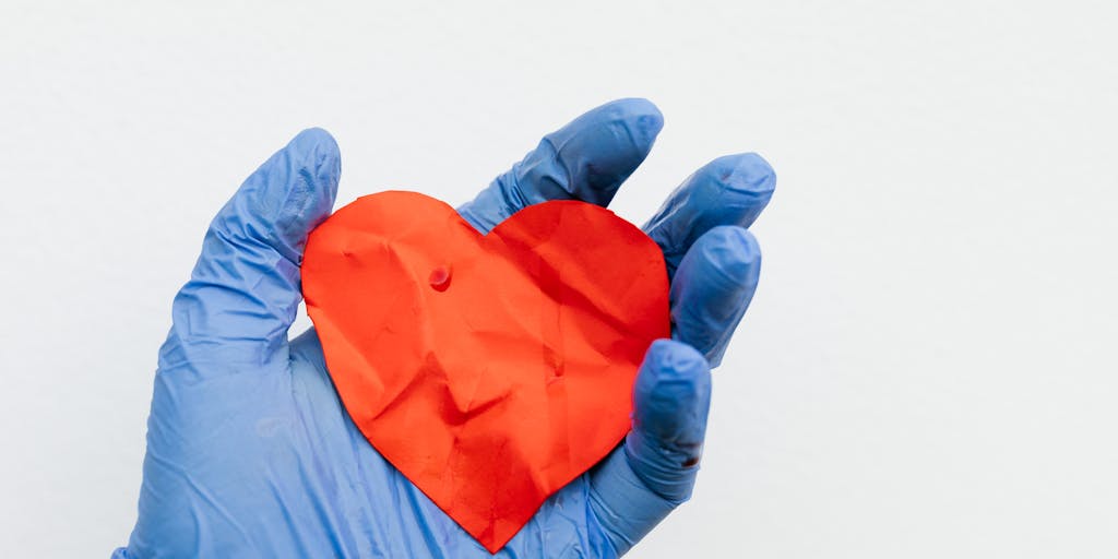 A close-up shot of a person holding a scale, with one side filled with medical bills and the other side filled with emotional symbols like a broken heart or a sad face. This visual metaphor represents the balance between financial compensation and emotional suffering in personal injury cases.