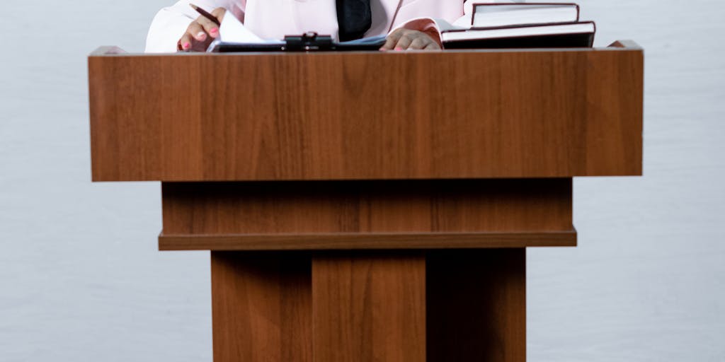 A courtroom scene where a property damage lawyer is passionately presenting a case, with visuals of damaged properties projected behind them. This highlights the lawyer's role in fighting for justice.