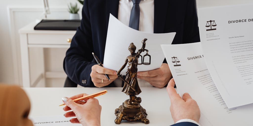 A candid moment captured during a high-stakes negotiation meeting, with a group of well-dressed lawyers engaged in discussion around a conference table. The focus is on the intensity of the conversation, with legal documents and laptops scattered around, highlighting the seriousness of their work.