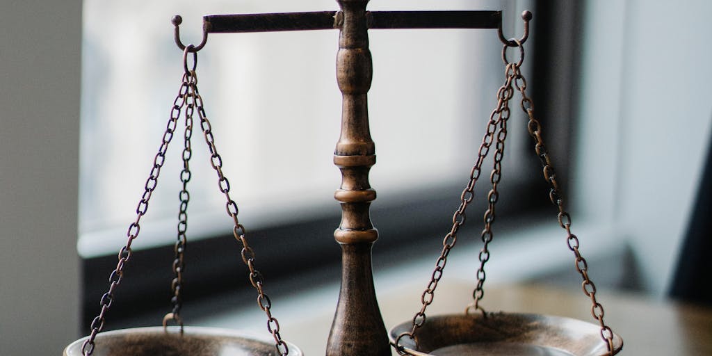 A split image showing a judge in a courtroom on one side and a bureaucrat in an office on the other. The judge is looking at a stack of legal books, while the bureaucrat is surrounded by regulatory documents. This visual contrast represents the balance of judicial interpretation and administrative authority in Chevron deference.