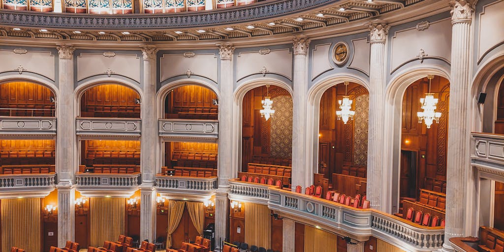 An artistic shot of a prestigious law firm building in Pennsylvania, with a focus on the entrance featuring grand columns and an elegant sign. The image captures the essence of success and professionalism, representing the firms that employ the highest-paid lawyers.