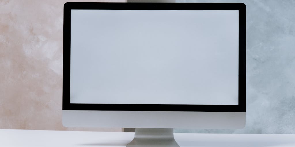 An elegant desk setup featuring a luxurious leather briefcase, a fountain pen, and a stack of legal documents, all arranged in a sophisticated manner. The background should include a blurred view of a city skyline, representing the high-stakes environment in which top lawyers operate.