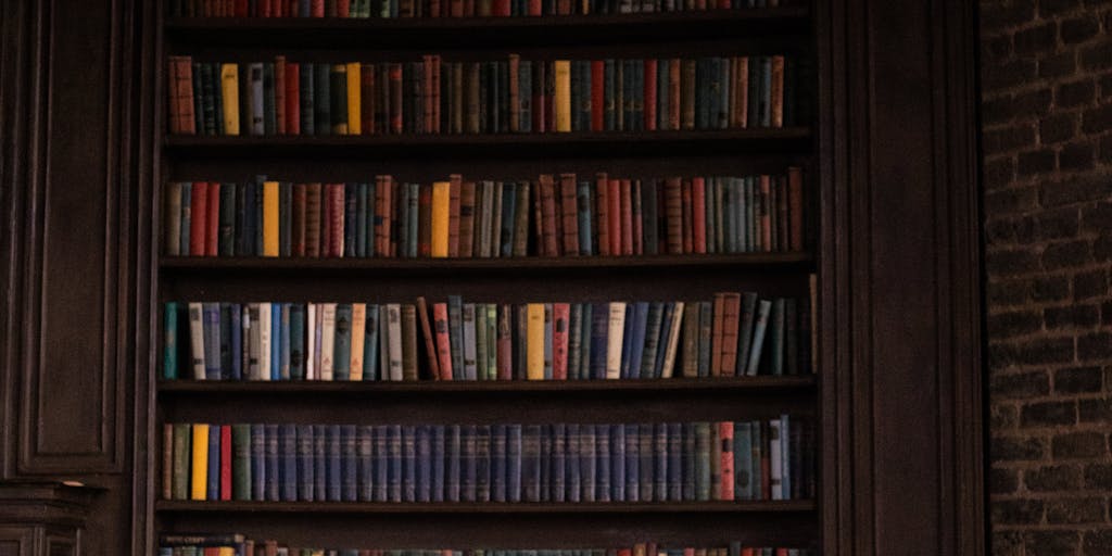 An artistic close-up of a gavel resting on a stack of legal books, with a blurred background of a luxurious office setting. The gavel represents justice, while the opulent surroundings hint at the high earnings of top lawyers in Brunei.