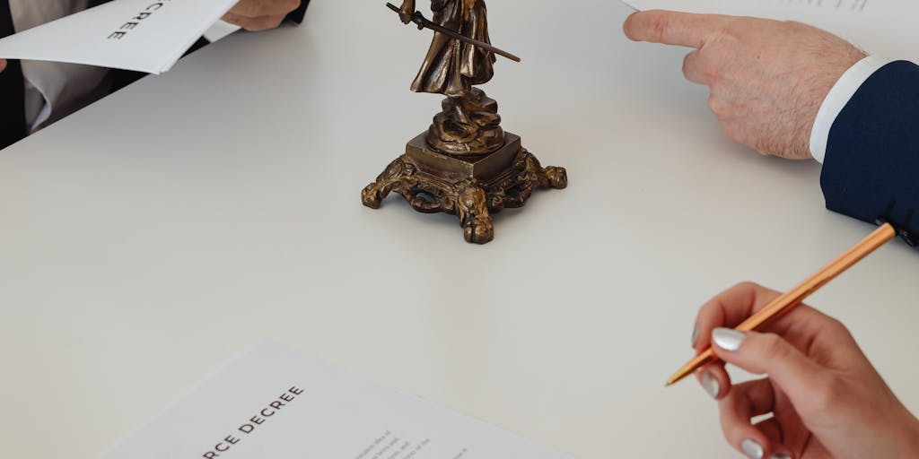 An artistic shot of a lawyer's briefcase opened on a desk, revealing high-end stationery, a tablet displaying legal documents, and a pair of designer glasses. This image captures the essence of professionalism and the tools of the trade for Georgia's highest-paid lawyers.