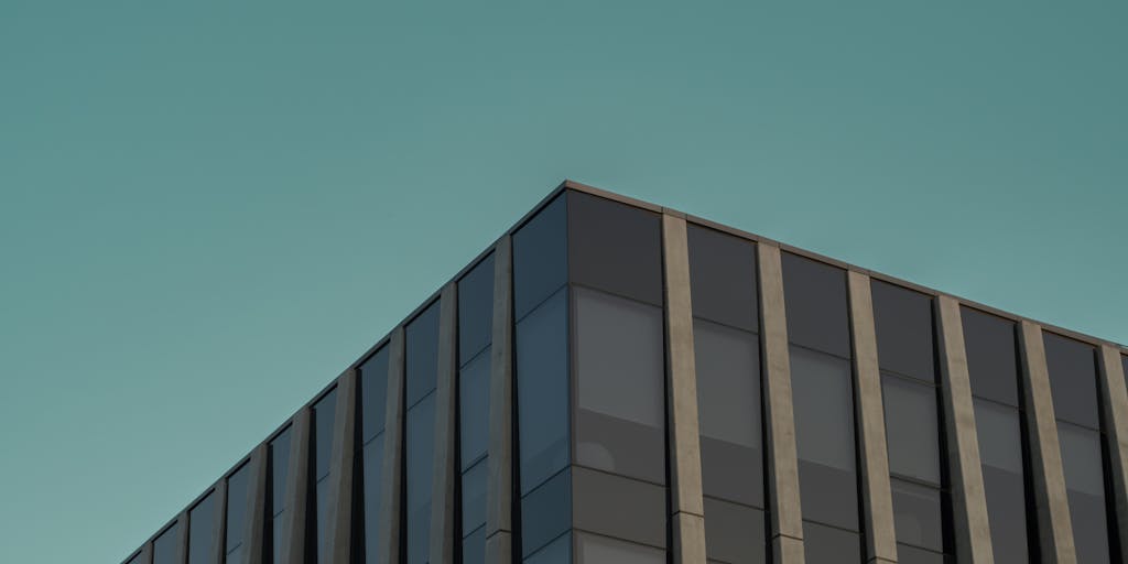 A dramatic shot of a high-rise office building in Honiara, with a lawyer in a sharp suit standing confidently in front of it, holding a briefcase. The skyline reflects the modern legal landscape of the Solomon Islands, symbolizing success and ambition in the legal profession.