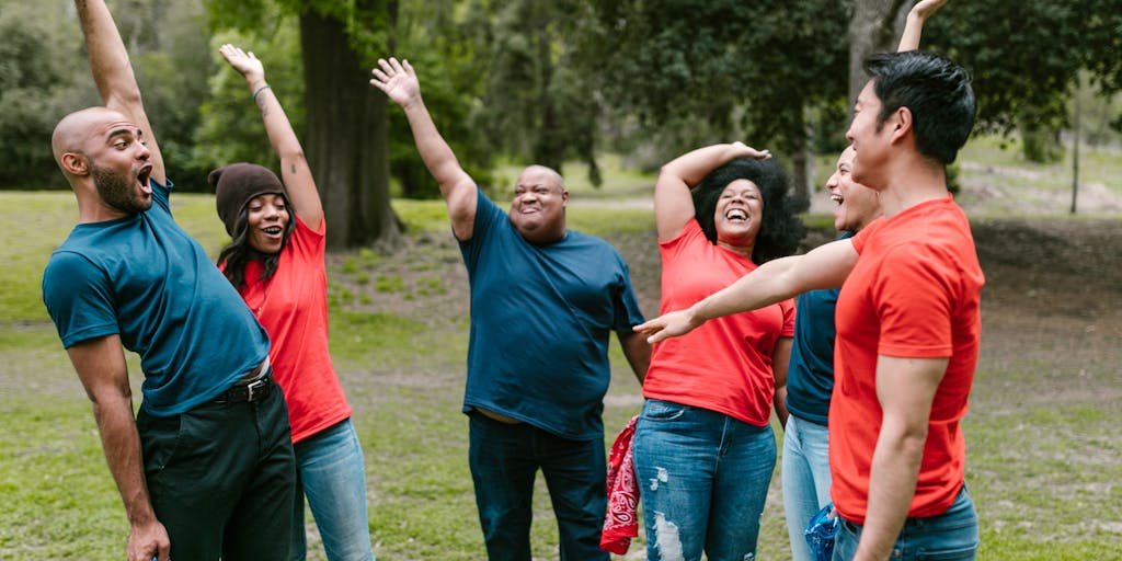 A whimsical scene in a park where people of different ages and backgrounds are engaged in various activities, such as painting, playing music, practicing yoga, and reading. The image captures the essence of community and the idea of inclusion in leisure activities.