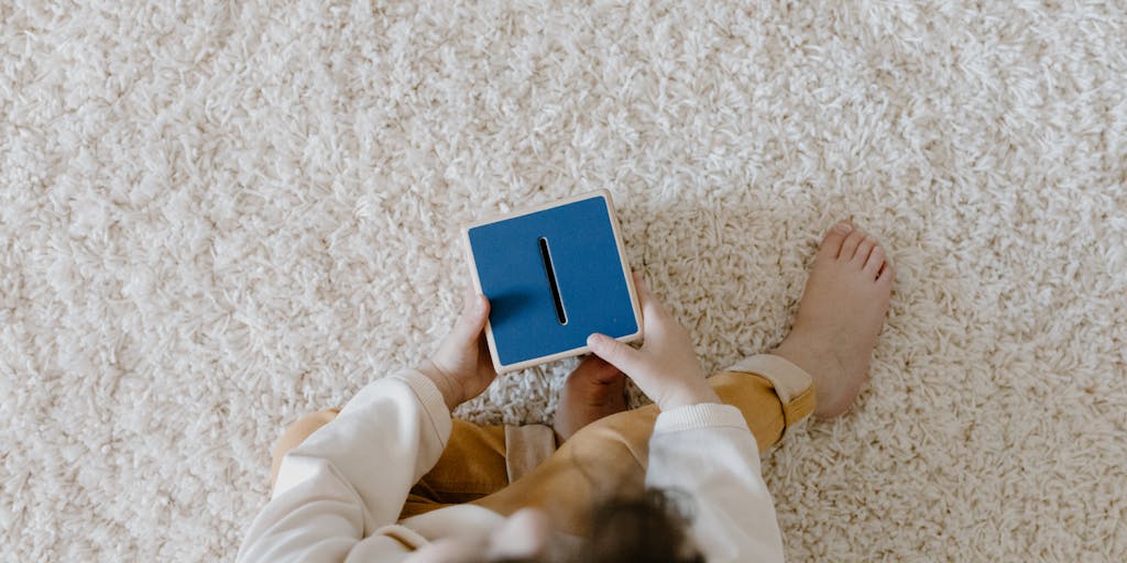 A conceptual photo of a gavel and a stack of money on a courtroom table, with a blurred image of a child playing in the background. This juxtaposition emphasizes the legal and financial implications of child support decisions.