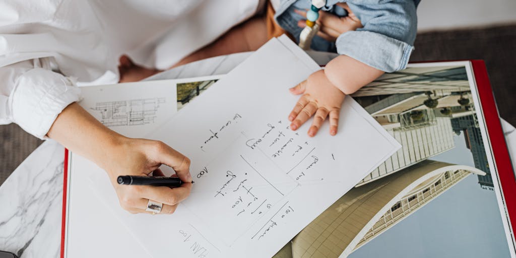 A close-up shot of a child's drawing on a piece of paper, depicting a family with a sun and a house, alongside a faded document of a child support agreement. This image captures the innocence of childhood and the underlying complexities of family dynamics and financial support.