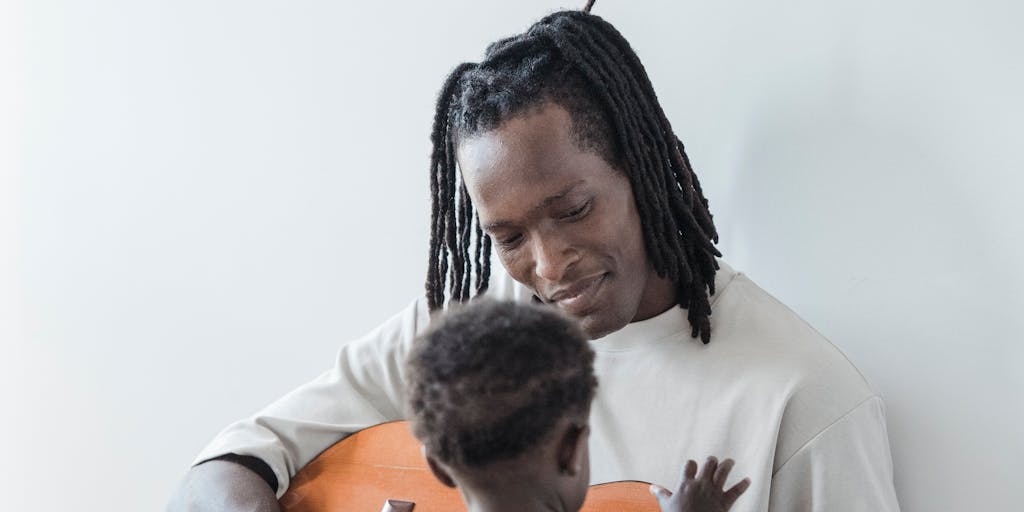 A split image showing two contrasting lifestyles: on one side, a child happily playing in a well-furnished room with toys and books, and on the other side, a parent looking stressed while reviewing bills and financial documents. This visual representation highlights the impact of child support on a child's quality of life.