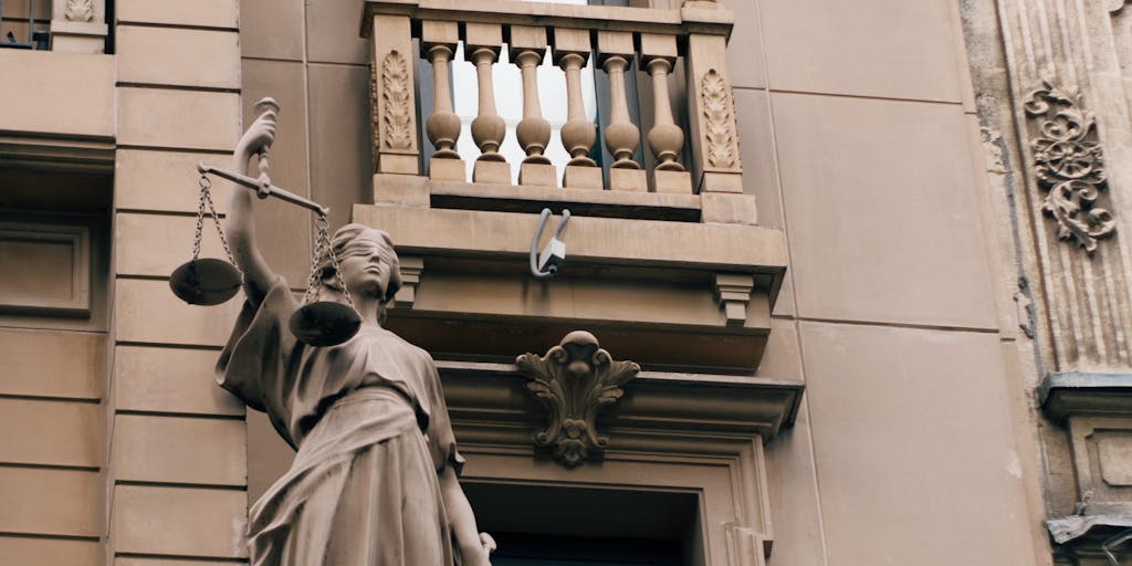 An overhead shot of a family court building with a gavel and legal documents in the foreground. The image captures the seriousness of child support discussions, with a focus on the legal aspect of determining financial responsibilities.