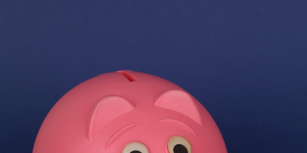 An artistic representation of a scale balancing a piggy bank on one side and a child's toy on the other. The scale is set against a backdrop of a city skyline, symbolizing the societal implications of child support laws. The image conveys the tension between financial obligations and the well-being of children.
