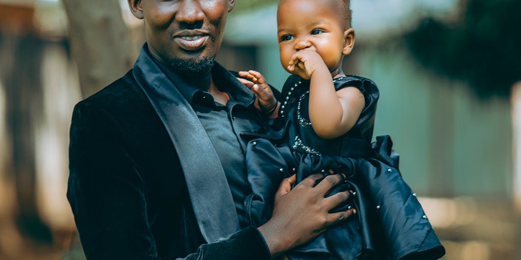 A split image showing two contrasting scenes: on one side, a parent happily spending time with their child in a park, and on the other side, a stack of bills and tax forms on a table. This visual juxtaposition highlights the emotional aspect of child support versus the financial responsibilities involved.