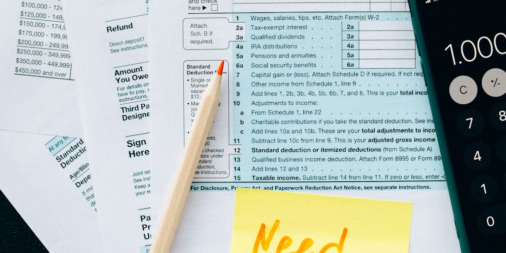 An artistic representation of a large tax form with a 'Not Deductible' stamp prominently displayed. Surrounding the form are various items representing child expenses, like toys, school supplies, and clothing, symbolizing the financial responsibilities that come with parenting.