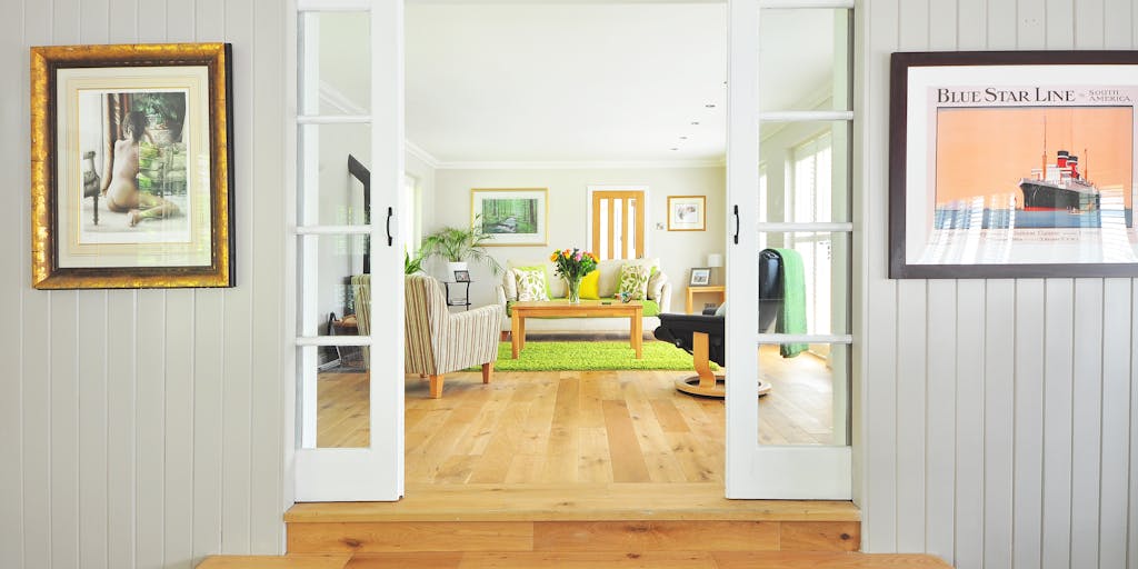 A split image showing two contrasting lifestyles: on one side, a parent enjoying a lavish lifestyle with luxury items and vacations, and on the other side, a modest home with a single parent managing bills and childcare. This visual representation highlights the disparity in financial responsibilities and child support.