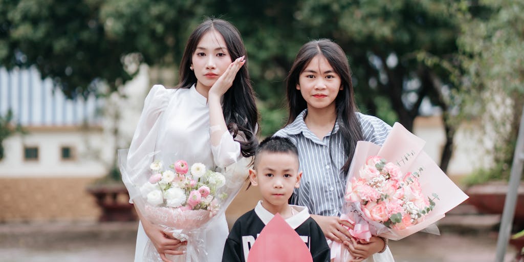 A split image showing two contrasting lifestyles: on one side, a parent enjoying a day out with their child at a park, and on the other side, a parent looking stressed while reviewing bills at a kitchen table. This visual representation highlights the financial implications of child support.