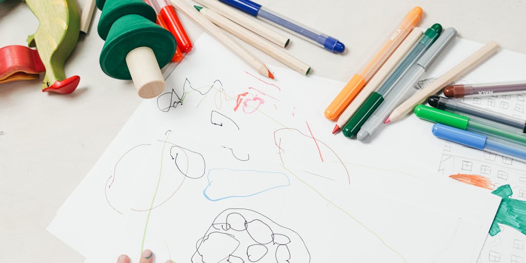 A close-up shot of a calendar marked with important dates related to child support payments, alongside a child's drawing or artwork. This juxtaposition illustrates the connection between financial responsibilities and the child's life.