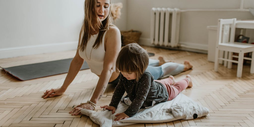 A candid photo of a parent and child engaging in a fun activity, like baking or playing a game, with a visible stack of paperwork in the background. This captures the essence of parenting amidst financial obligations, showcasing the joy of parenting despite challenges.