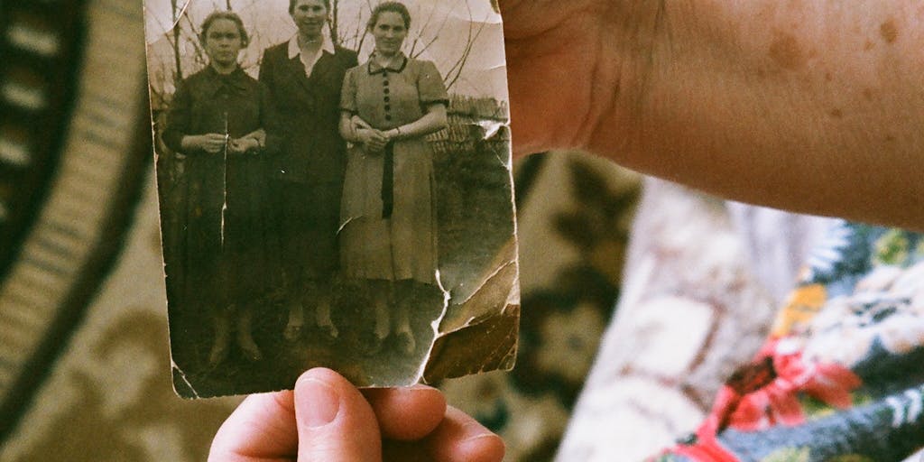 A family photo with a faded image of a parent in the background, symbolizing the emotional impact of signing over parental rights. The foreground shows a child playing, representing the ongoing need for support despite the legal changes.