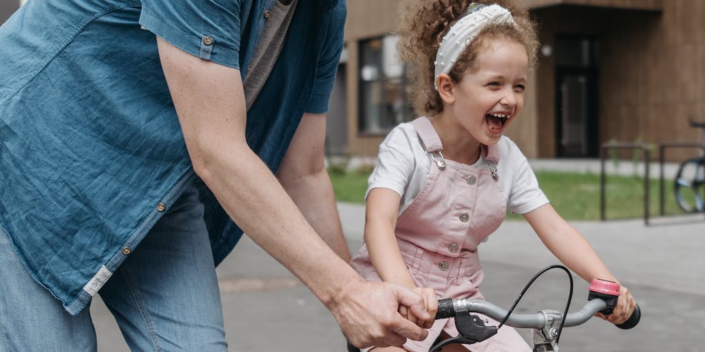 A heartwarming photo of a parent and child engaging in a fun activity, like playing in a park or cooking together, with a subtle overlay of child support statistics in the background. This image illustrates the emotional connection and the importance of financial support in nurturing relationships.