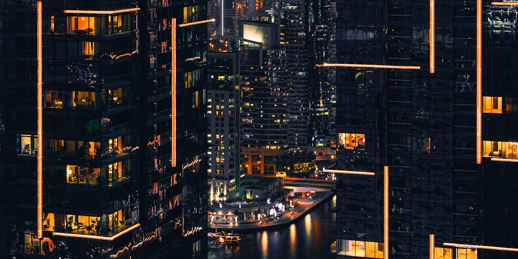 A conceptual image featuring a futuristic city skyline at dusk, with digital elements and glowing icons representing AI technology. In the foreground, a person is holding a tablet with the Instantly.ai interface visible, symbolizing the integration of AI into everyday life.