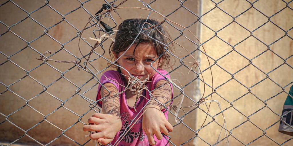 An artistic representation of a broken chain symbolizing the severing of parental rights. In the background, a faded image of a child playing alone in a park, representing the impact of these decisions on the child's life. The chain links are rusted, indicating the permanence of the decision.