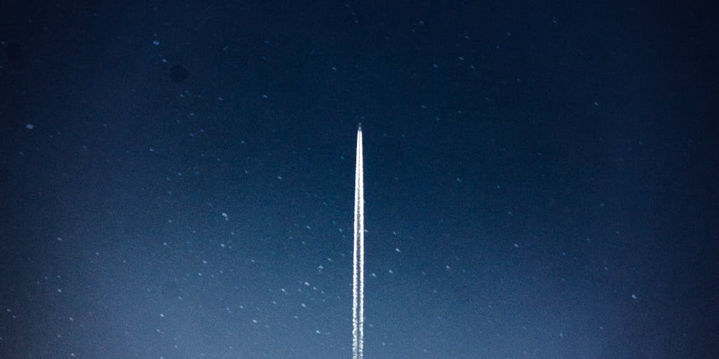 A visually striking image of a rocket launching into the sky, with a digital overlay of pricing tags and graphs illustrating the value of Rocketreach's pricing plans. The rocket symbolizes growth and reaching new heights, while the pricing elements highlight the service's affordability and effectiveness.