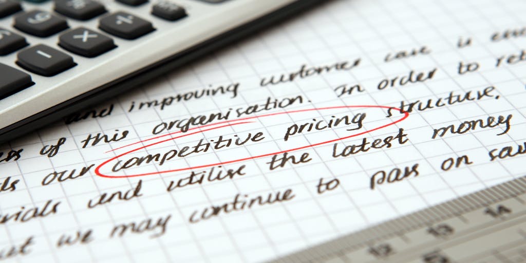 A creative flat lay of a calculator, sticky notes, and a digital tablet displaying an AI pricing chart. The sticky notes should have handwritten notes about pricing strategies, and the calculator should show a calculation related to AI costs. This setup conveys a brainstorming session about AI pricing.