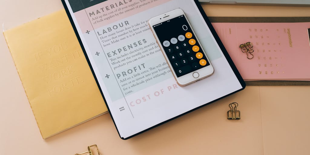 A close-up shot of a hand holding a smartphone displaying the Meet Alfred pricing page, with a blurred background of a modern office setting. The focus on the phone emphasizes the digital aspect of pricing while the office setting conveys a professional environment.