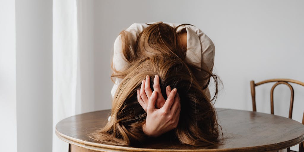 A split image showing two scenarios: one side depicts a stressed individual overwhelmed by high costs, while the other side shows a relaxed person happily using Saleshandy with a clear pricing plan. This visual contrast highlights the value of affordable pricing.