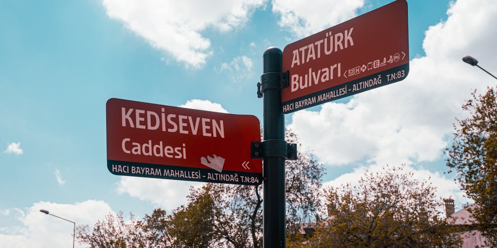 A conceptual image of a person standing at a crossroads with multiple signposts indicating different pricing plans for Marketo Engage. The setting is outdoors, symbolizing the journey of choosing the right marketing solution.