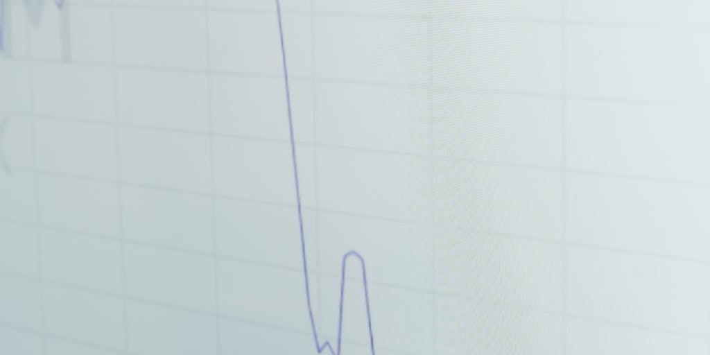 A dynamic image of a person pointing at a digital screen displaying a graph of Zopto pricing trends, with a thoughtful expression. The background should be a modern office environment, highlighting the importance of data in pricing decisions.