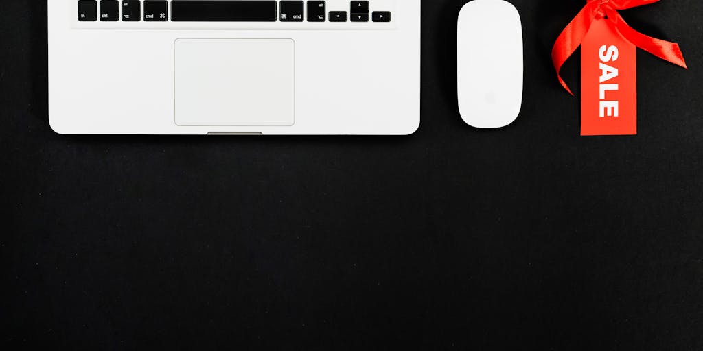 A visually striking image of a digital pricing tag floating above a laptop screen displaying the Waalaxy interface. The tag should have vibrant colors and bold typography showcasing different pricing tiers, with a blurred background of a modern workspace to emphasize a tech-savvy environment.