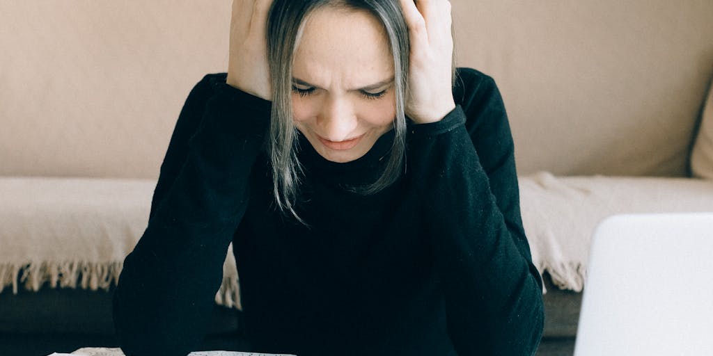 A split image showing two contrasting scenarios: one side depicts a stressed individual surrounded by bills and financial documents, while the other side shows a relaxed person using Buzzstream on a laptop, with a clear pricing plan visible on the screen. This juxtaposition illustrates the ease of managing costs with Buzzstream.