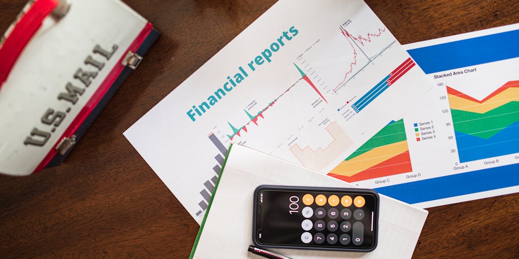 A close-up shot of a hand holding a smartphone displaying a colorful graph of sales engagement metrics, with a blurred background of a modern office setting. The image should convey a sense of technology and data-driven decision-making.