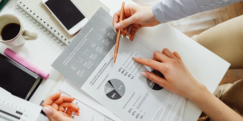 A close-up shot of a crystal ball resting on a stack of financial documents, symbolizing the clarity and insight that Crystalknows Pricing provides. The documents should include graphs and charts that represent pricing strategies, with soft lighting to create a mystical atmosphere.