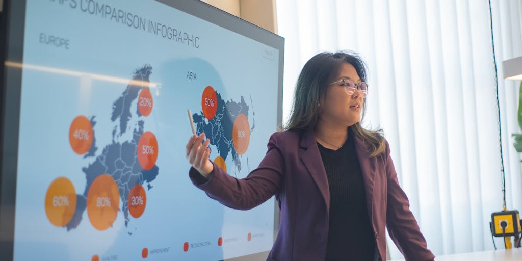 A diverse group of marketers gathered around a table, analyzing a large printed infographic that highlights the effectiveness of Facebook advertising. The image captures their engaged expressions and collaborative spirit.