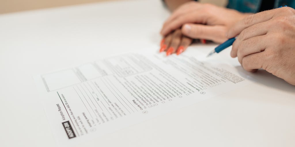 A split image showing a father on one side looking contemplative and sad, with a child’s drawing of a family in the background. On the other side, a legal document with the words 'Child Support' prominently displayed. This juxtaposition highlights the emotional conflict between parental rights and financial responsibilities.