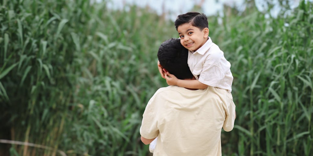 A split image showing two scenarios: on one side, a parent happily playing with their child outdoors, and on the other side, the same parent in a courtroom setting discussing child support termination with a lawyer. This juxtaposition highlights the emotional journey.