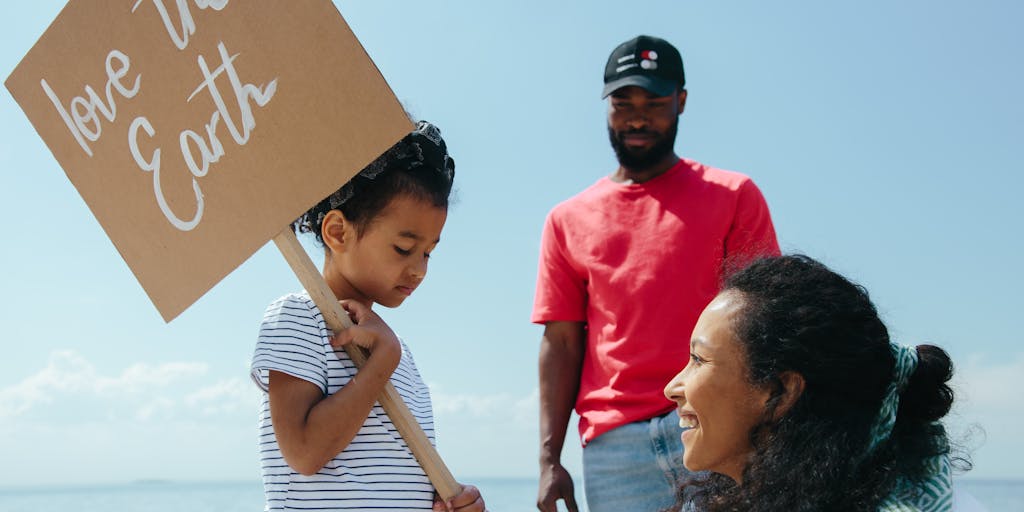 A close-up of a child holding a phone, with a visible text conversation on the screen between parents discussing child support. The background features a blurred image of a calendar with marked dates, representing the importance of timely payments and communication.