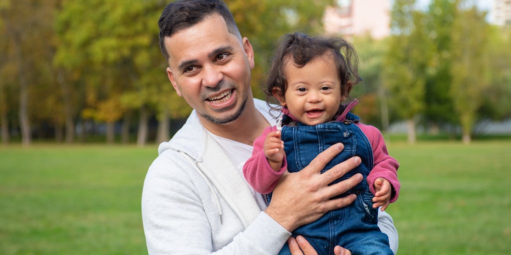 A serene outdoor scene featuring a parent and child enjoying a day at the park, with a subtle overlay of legal symbols like scales of justice and a document icon, illustrating the positive outcome of successfully terminating child support.