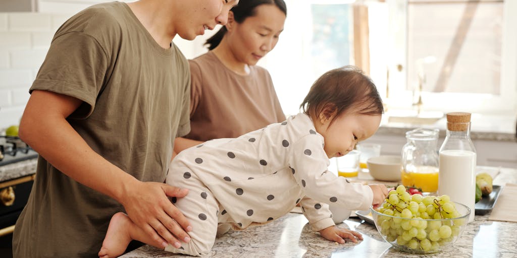 A conceptual photo of a maze made of food items and child support papers, with a person navigating through it. This visual metaphor represents the complex journey of applying for assistance while dealing with child support issues.