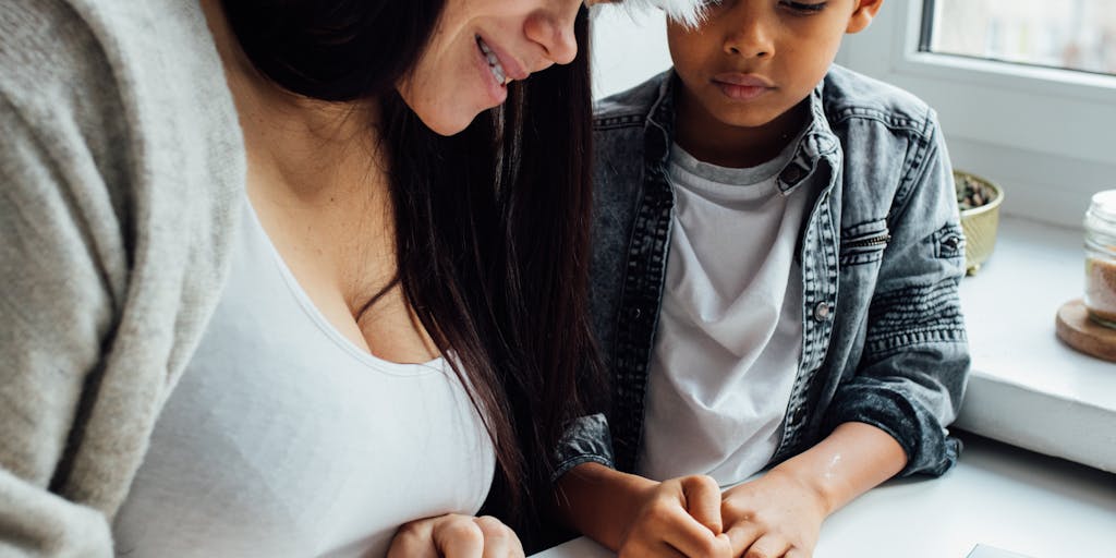 A split image showing two scenarios: on one side, a parent happily playing with their child, and on the other side, the same parent looking distressed while reading a letter about child support arrears. This juxtaposition highlights the emotional toll of financial obligations.