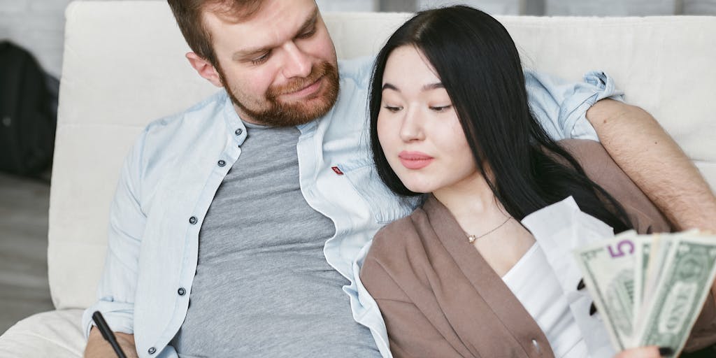 A conceptual image of a scale balancing a heart on one side and a stack of money on the other, symbolizing the emotional and financial aspects of child support. The background can be a blurred image of a family gathering, emphasizing the importance of support in family dynamics.
