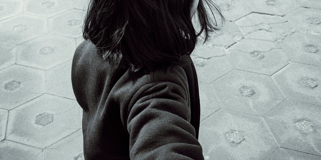A split image showing two scenarios: one half depicts a parent receiving a Social Security check, while the other half shows a child happily playing with toys. This juxtaposition emphasizes the impact of garnishment on both the parent and child.
