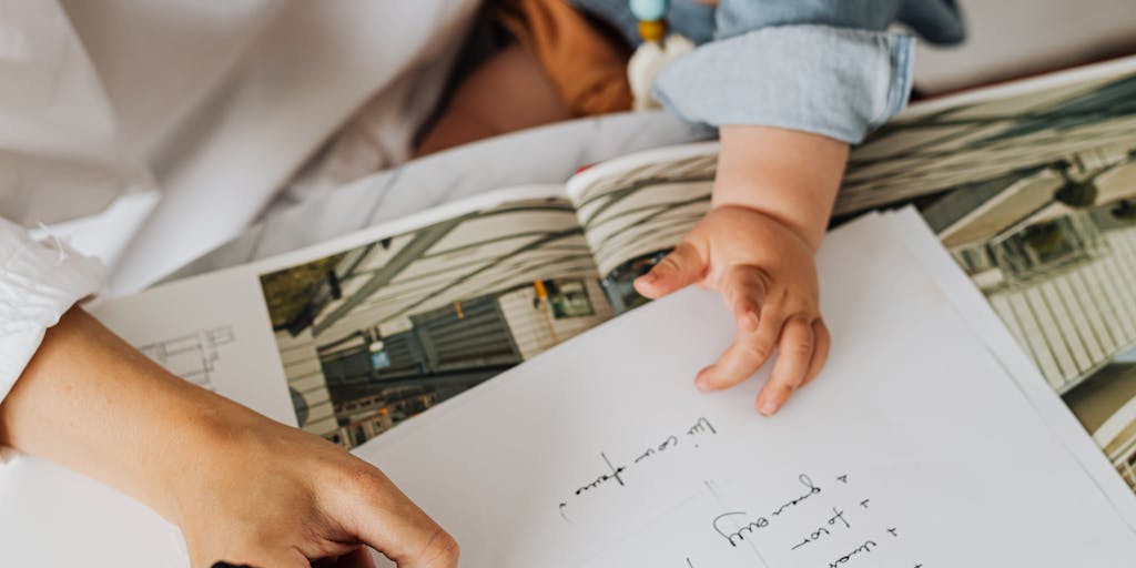 A close-up shot of a legal document with the words 'Child Support' prominently displayed, surrounded by baby items like a pacifier and a toy. This image conveys the serious nature of the topic while also hinting at the emotional aspects of parenting and responsibility.