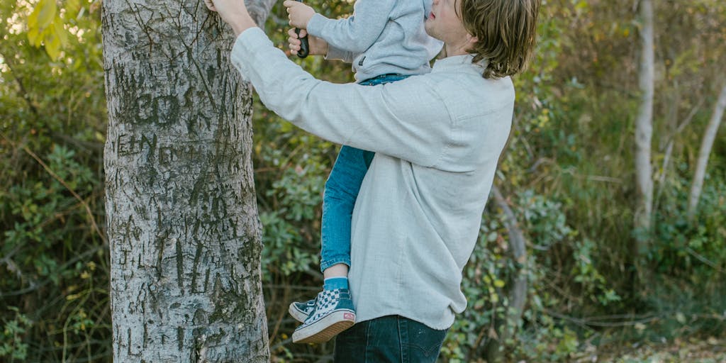 An artistic representation of a family tree with dollar signs integrated into the branches, illustrating the financial implications of child support arrears. The tree should have leaves that represent different family members, emphasizing the impact of financial decisions on family dynamics.