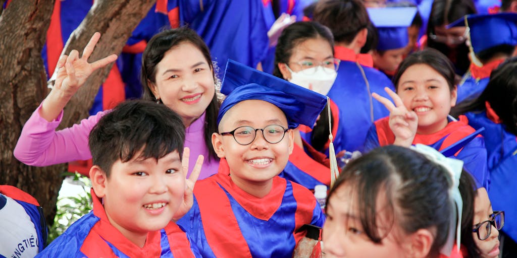 An artistic representation of a parent holding a 'Child Support' sign in one hand and a 'Congratulations on Turning 18' card in the other. The background features a blurred image of a graduation ceremony, emphasizing the duality of financial responsibility and the joy of reaching adulthood.